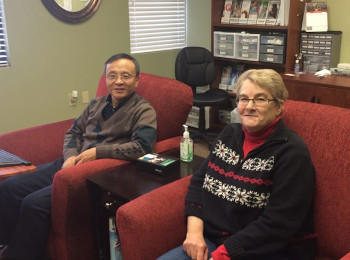 Dr. Zhou posing with a female patient