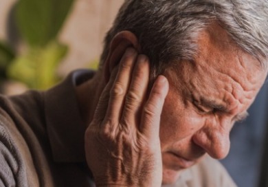Older man having serious ear pain